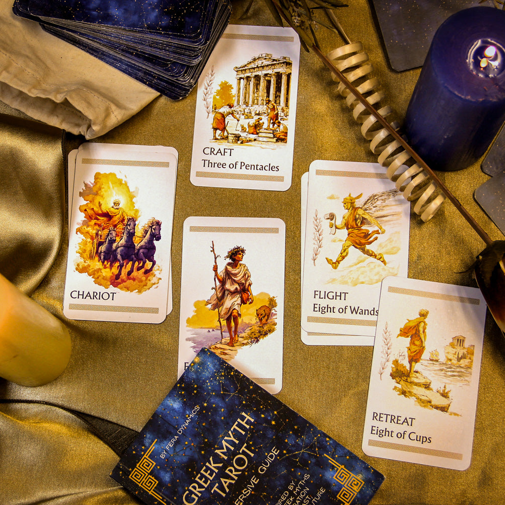 Greek myth tarot cards with candles and a book on a table